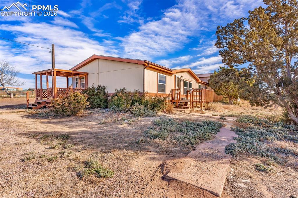1044 P Street Penrose, CO 81240 - Photo 4 of 48 a view of a house with a yard