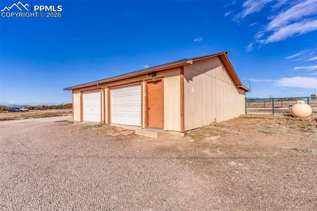 1044 P Street Penrose, CO 81240 - Photo 41 of 48 a view of an empty room with a empty space and wooden floor