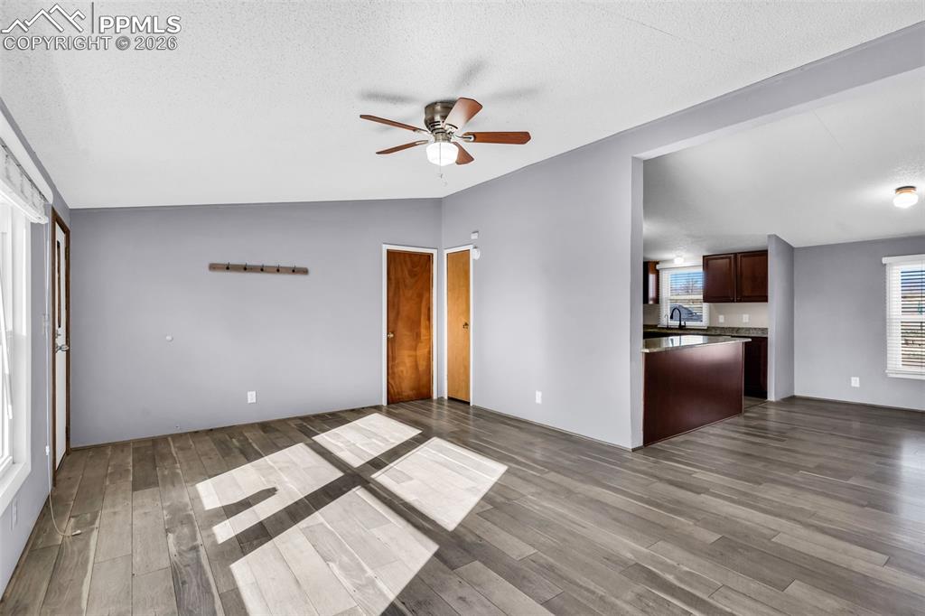 1044 P Street Penrose, CO 81240 - Photo 9 of 48 a view of livingroom with hardwood floor and ceiling fan