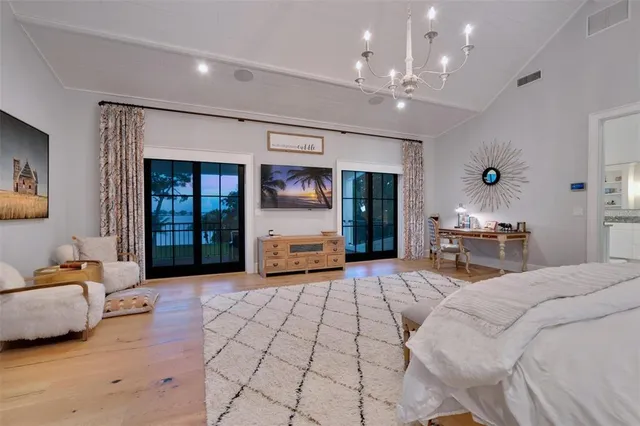 a bathroom with a granite countertop sink and a large mirror