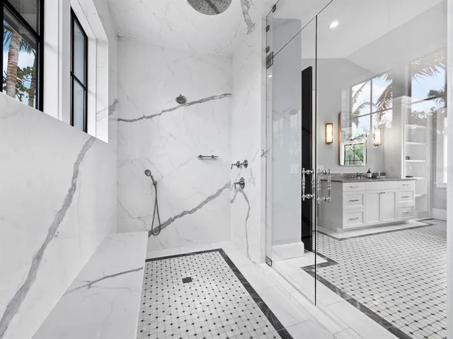 an aerial view of a house with a yard and garden in the back