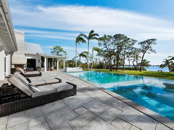 a view of a swimming pool with a garden