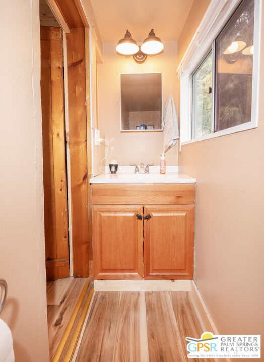 69 7 Oaks Road Angelus Oaks, CA 92305 - Photo 13 of 36 a view of a bathroom with a sink and a mirror