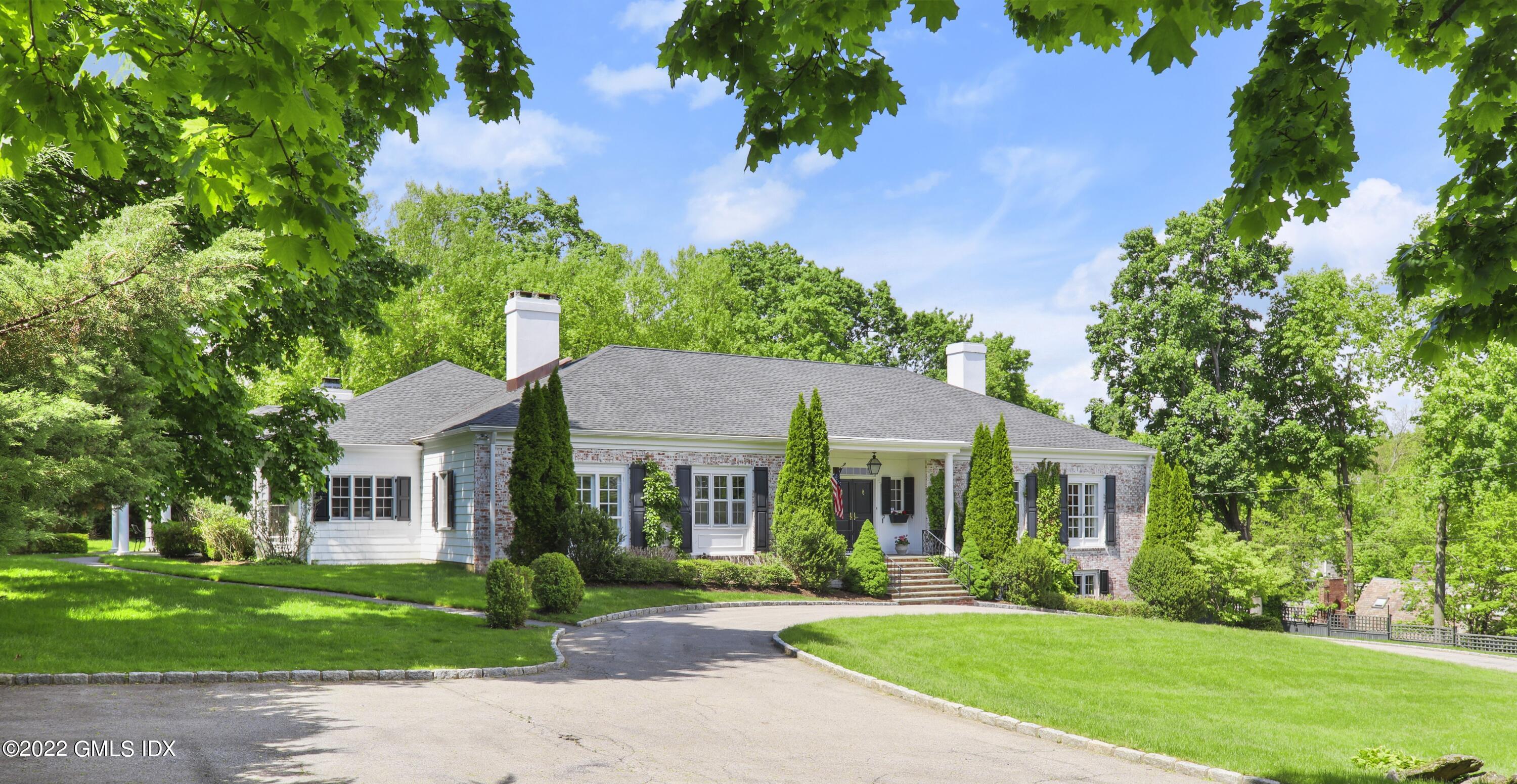 3 Copper Beech Road Greenwich, CT 06830 - Photo 1 of 1 front view of a house with a yard