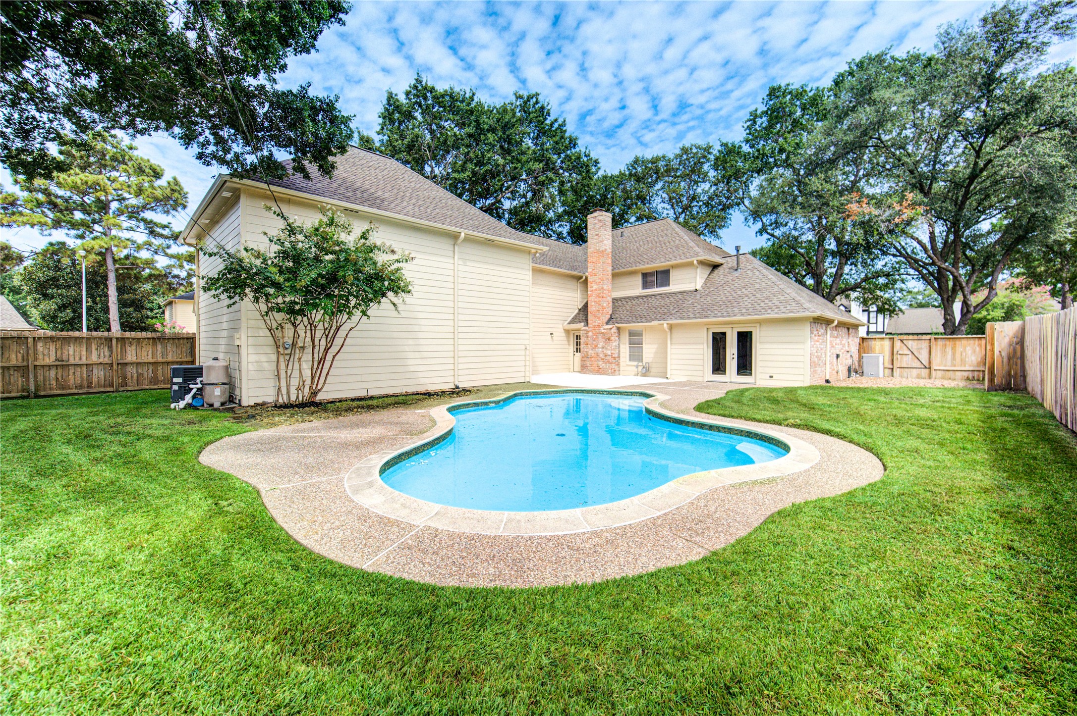 9115 Taidswood Drive Spring, TX 77379 - Photo 38 of 45 With this hot and humid Texas weather, who wouldn't want a refreshing pool in their backyard? It is a nice place to enjoy an evening or weekend swim.