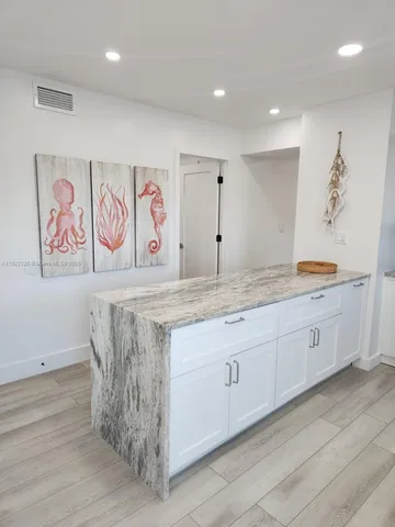 a bathroom with double vanity sink and a mirror