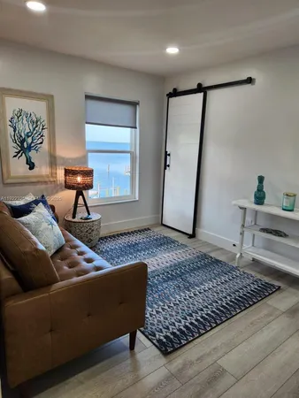 a living room with furniture and a rug