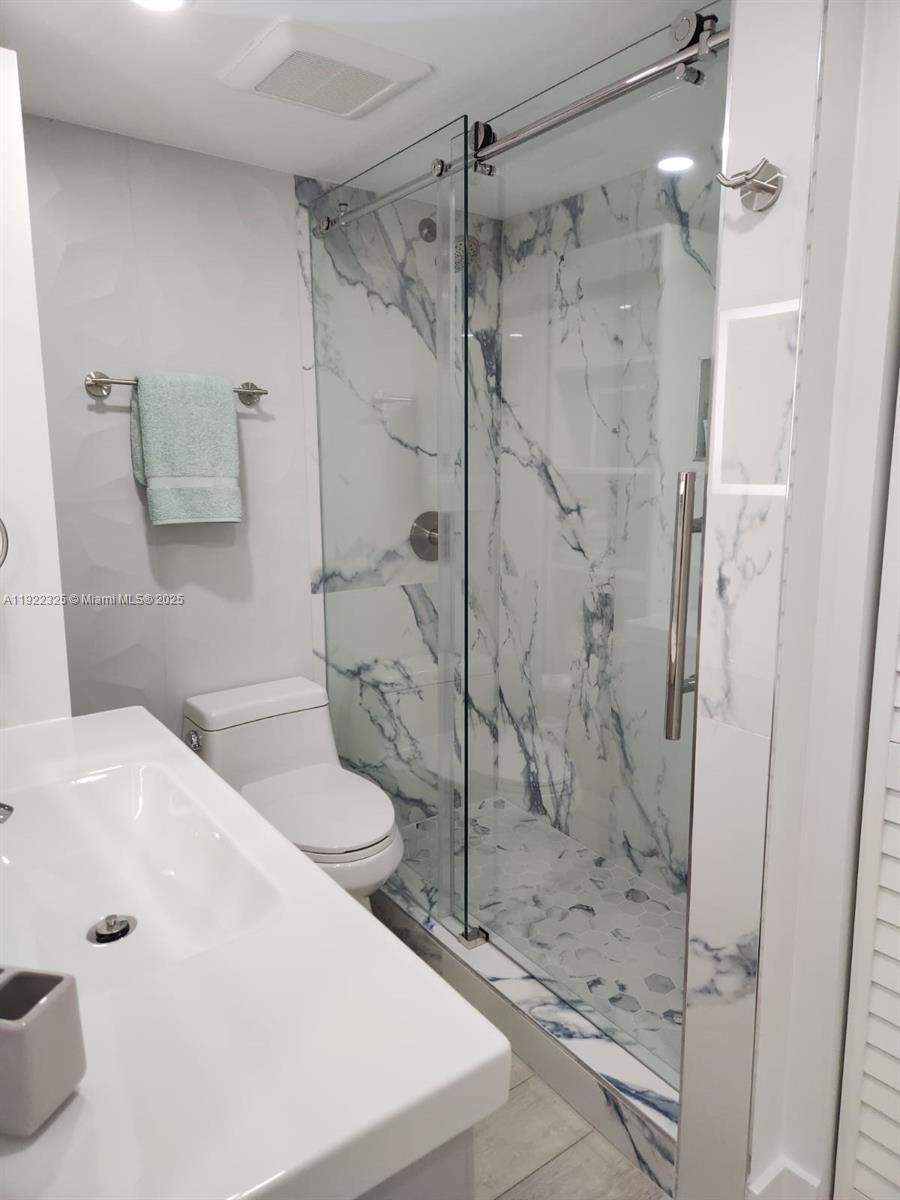 3320 Gulf Of Mexico Drive, Unit 208C Longboat Key, FL 34228 - Photo 29 of 39 a bathroom with a bathtub and a shower