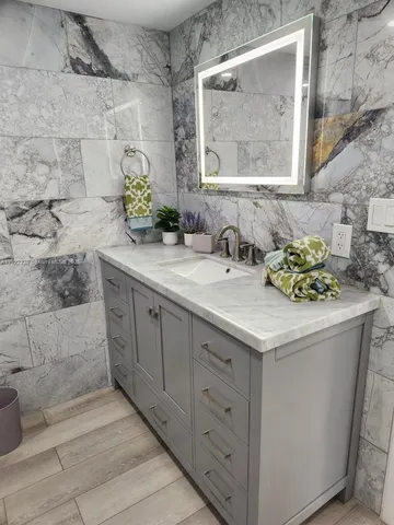 a bathroom with a sink and a mirror