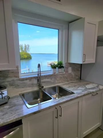 a kitchen with a sink and a window