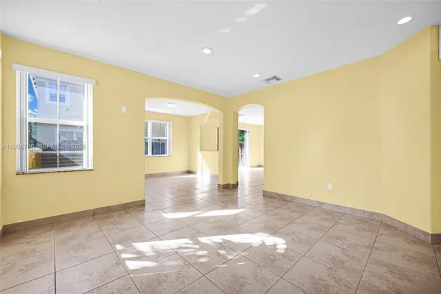 a view of a big room with windows