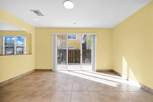 a view of an empty room with a fireplace