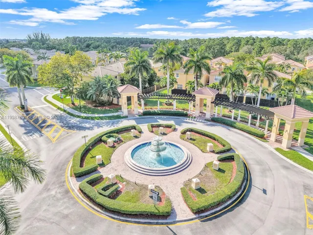 a view of a swimming pool with a yard and lake view