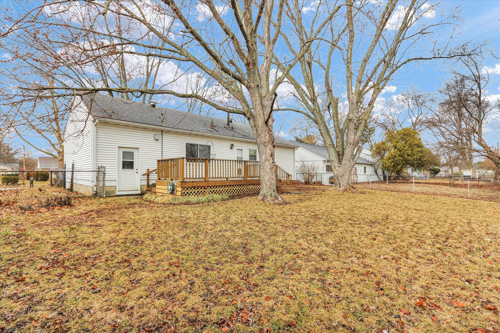 902 Oakcrest Drive Champaign, IL 61821 - Photo 20 of 22 a view of a yard with large trees