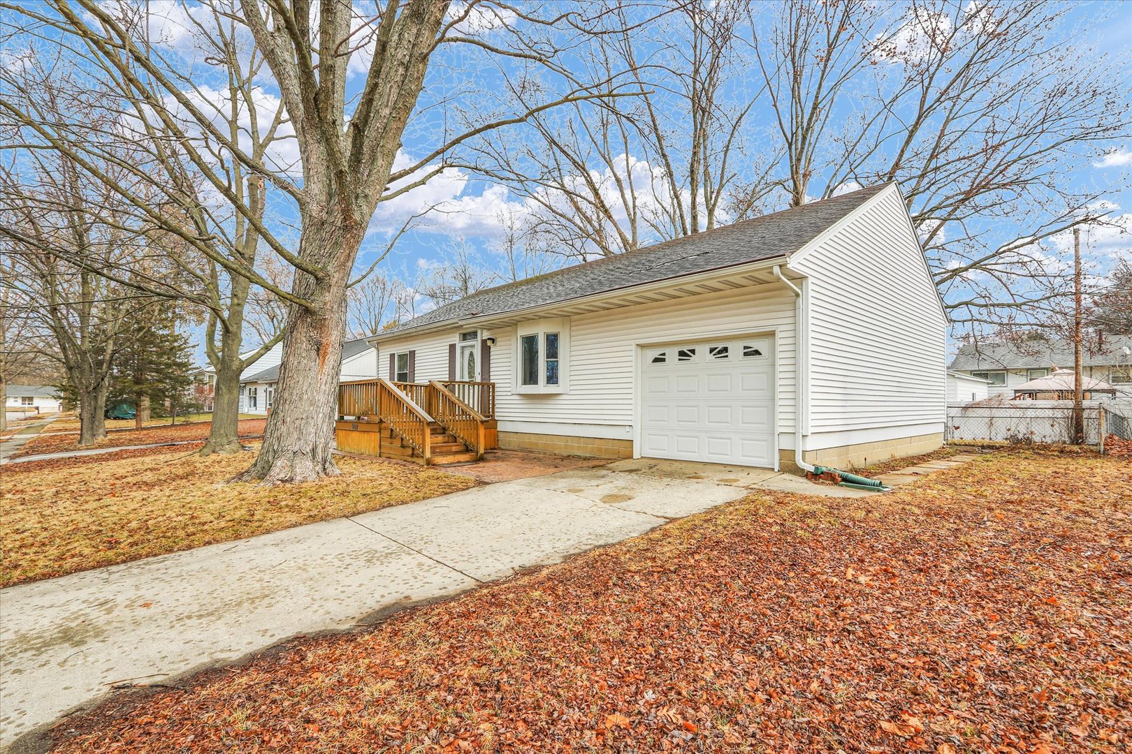902 Oakcrest Drive Champaign, IL 61821 - Photo 2 of 22 a house with trees in front of it