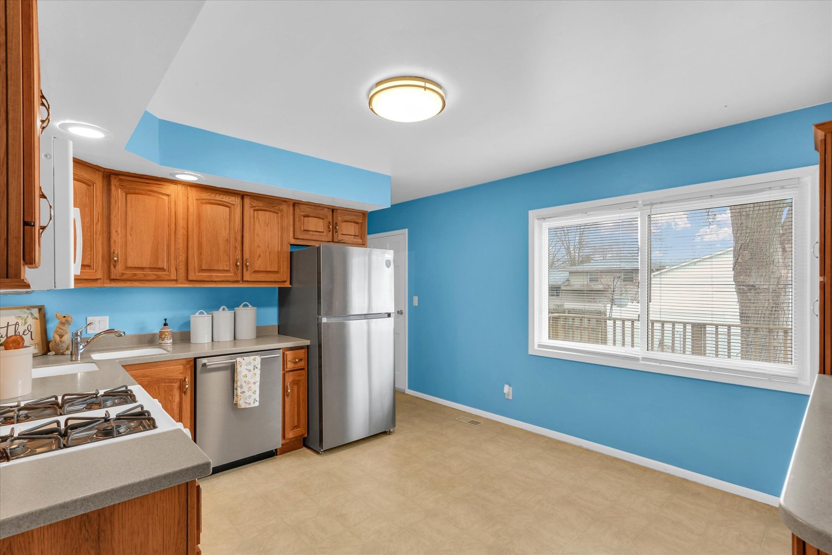 902 Oakcrest Drive Champaign, IL 61821 - Photo 5 of 22 a kitchen with stainless steel appliances granite countertop a refrigerator sink and cabinets