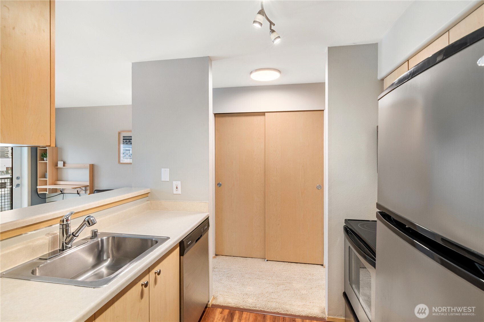 2824 Grand Avenue, Unit 603 Everett, WA 98201 - Photo 11 of 26 a bathroom with a sink and a mirror