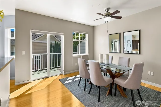 a view of a dining room with furniture and window