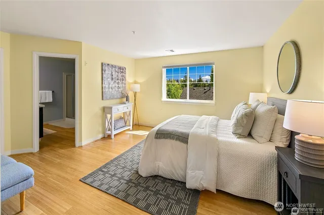 a bedroom with bed and a chair