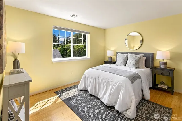 a bedroom with a bed and a window