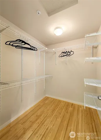 a view of a room with wooden floor