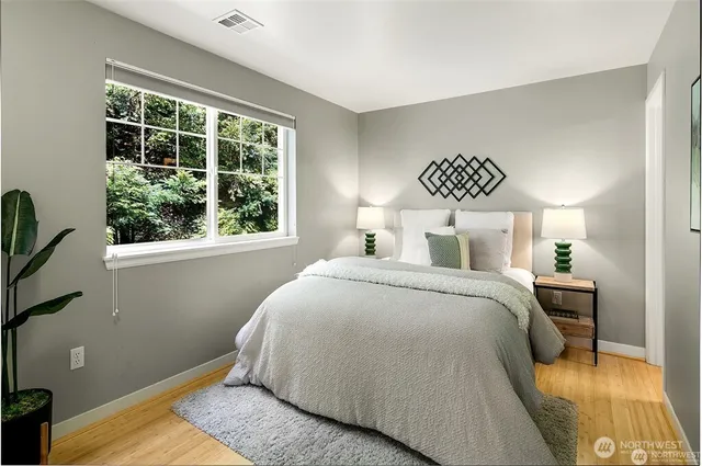 a bedroom with a bed and a window