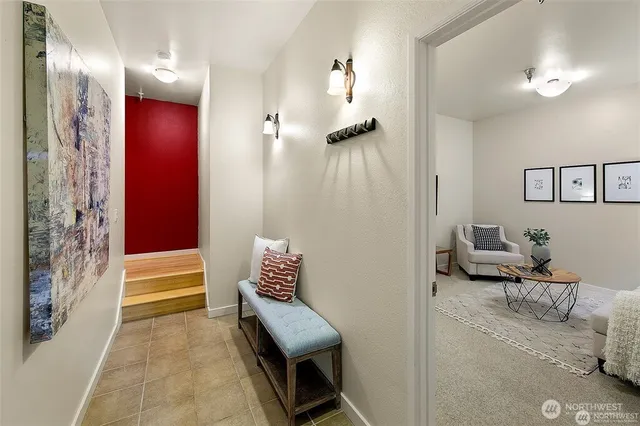 a bedroom with furniture and a chandelier