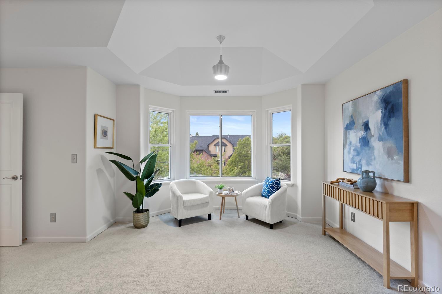 3900 Pierson Street Wheat Ridge, CO 80033 - Photo 21 of 39 a living room with furniture and a large window