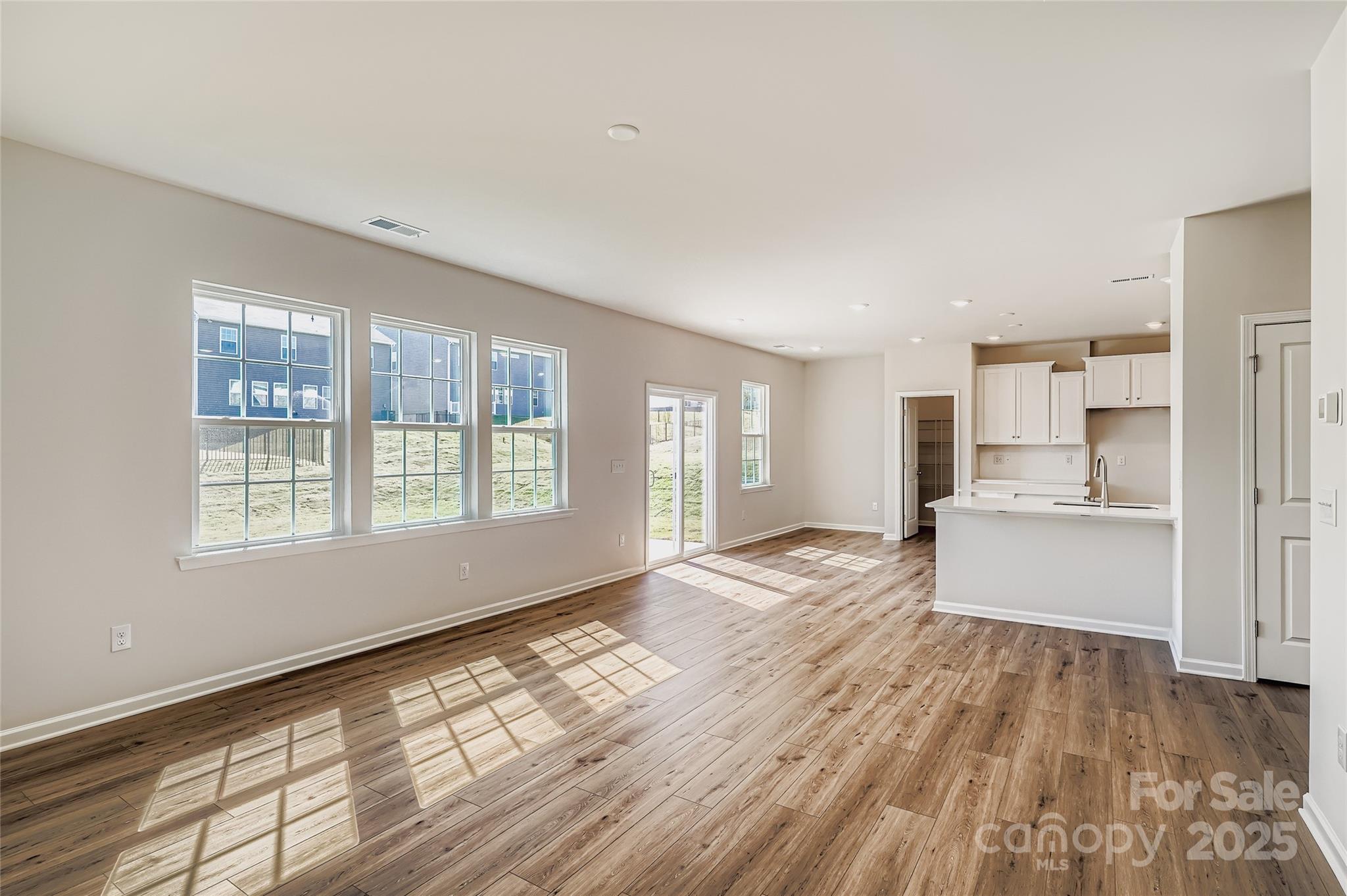 4345 Shimmering Stone Way Maiden, NC 28650 - Photo 3 of 13 a view of kitchen with wooden floor and electronic appliances