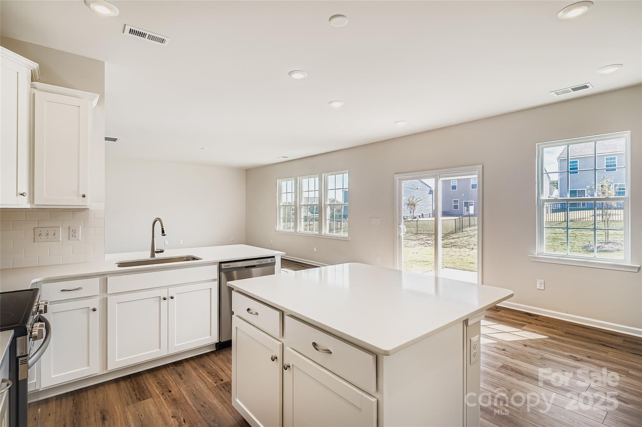 4345 Shimmering Stone Way Maiden, NC 28650 - Photo 5 of 13 a kitchen with a sink stove and cabinets