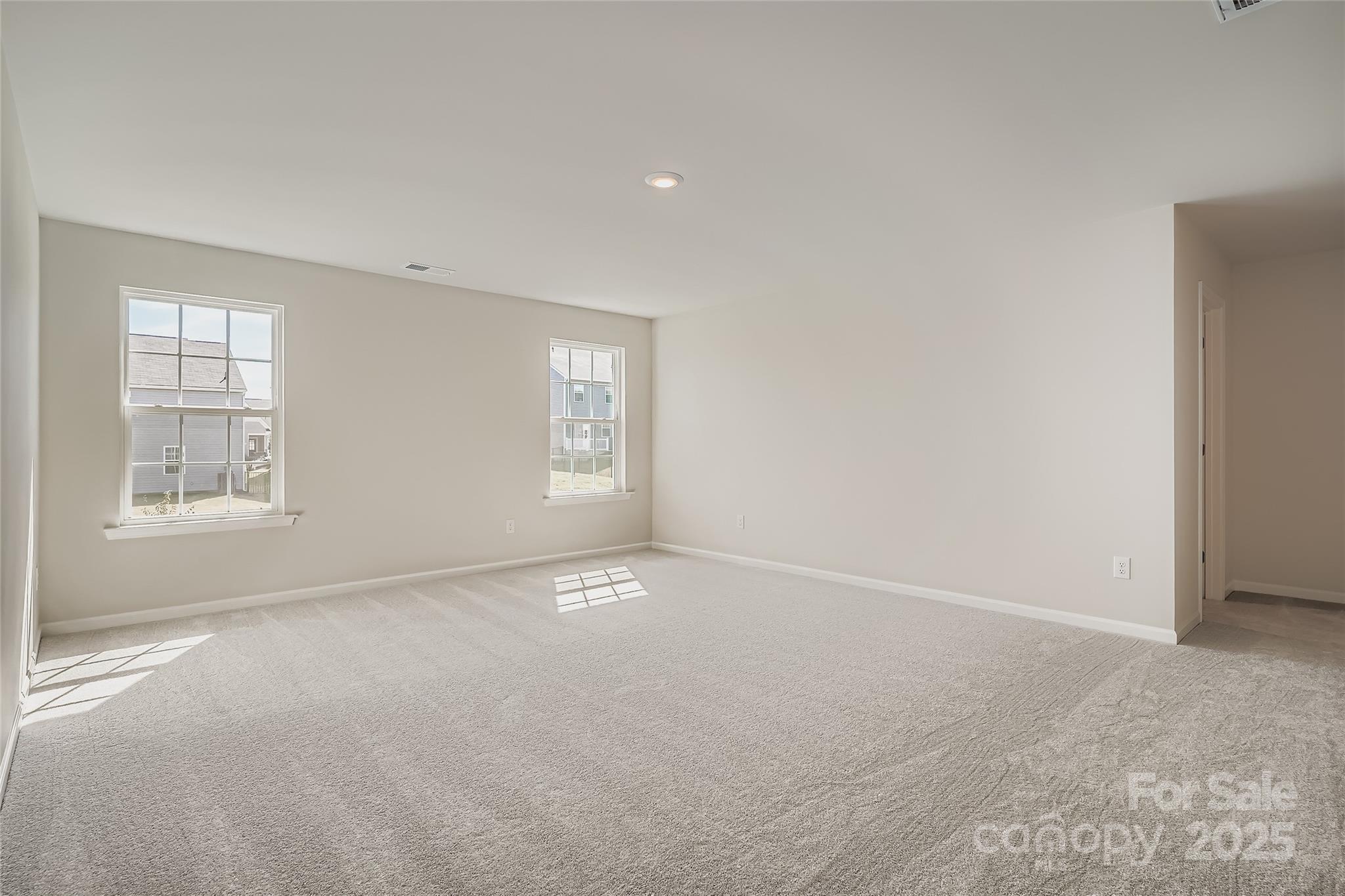 4345 Shimmering Stone Way Maiden, NC 28650 - Photo 6 of 13 an empty room with windows