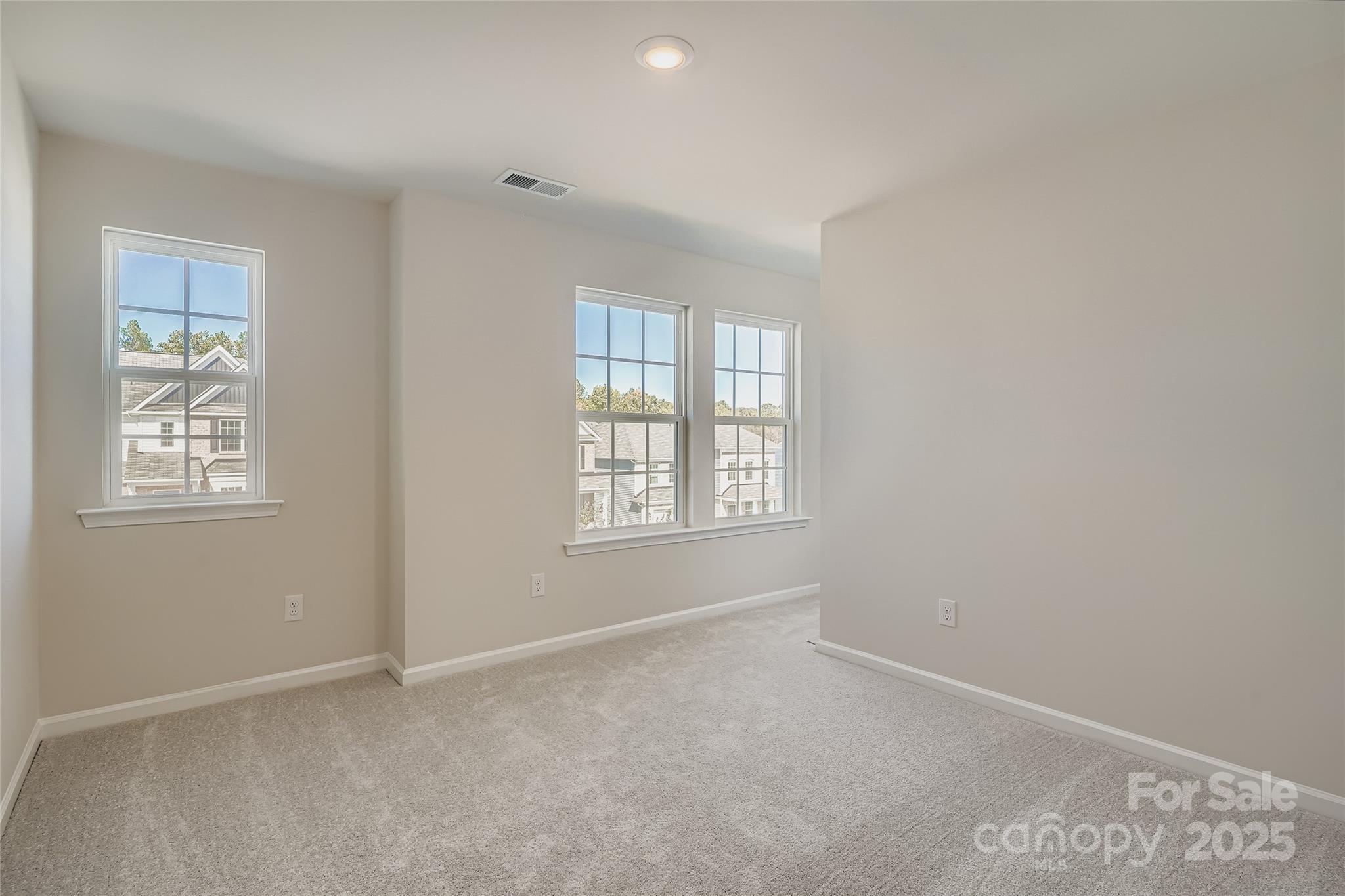 4345 Shimmering Stone Way Maiden, NC 28650 - Photo 9 of 13 an empty room with windows