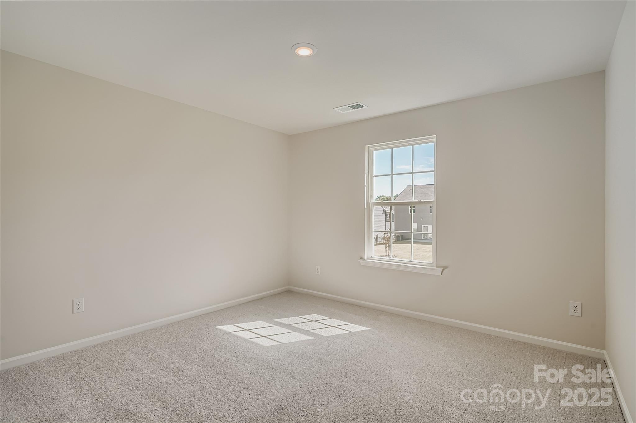 4345 Shimmering Stone Way Maiden, NC 28650 - Photo 10 of 13 an empty room with a window