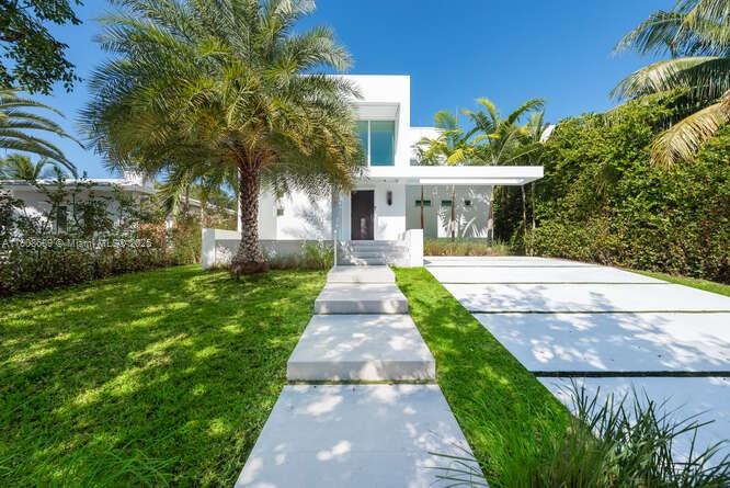 1325 Bay Drive Miami Beach, FL 33141 - Photo 3 of 49 a front view of a house with fountain