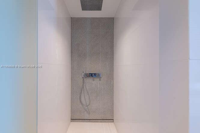 1325 Bay Drive Miami Beach, FL 33141 - Photo 31 of 49 a bathroom with a glass shower door