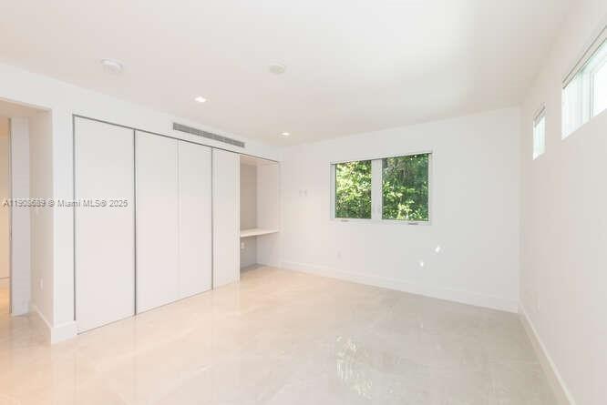 1325 Bay Drive Miami Beach, FL 33141 - Photo 39 of 49 an empty room with a window