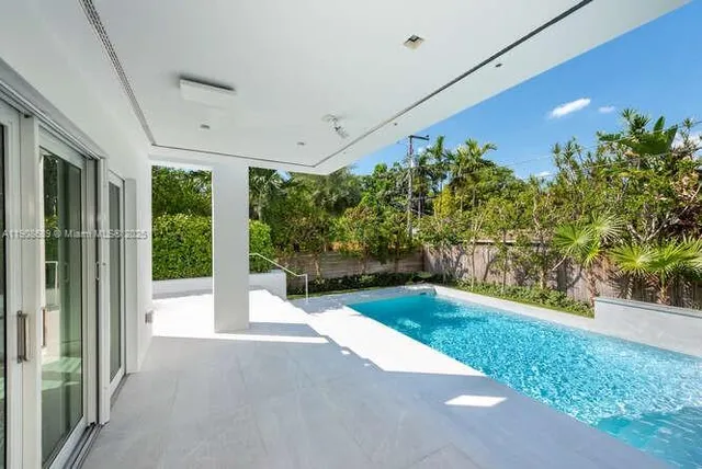 a view of an empty room with stairs