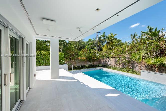 1325 Bay Drive Miami Beach, FL 33141 - Photo 7 of 49 a view of swimming pool with an outdoor space