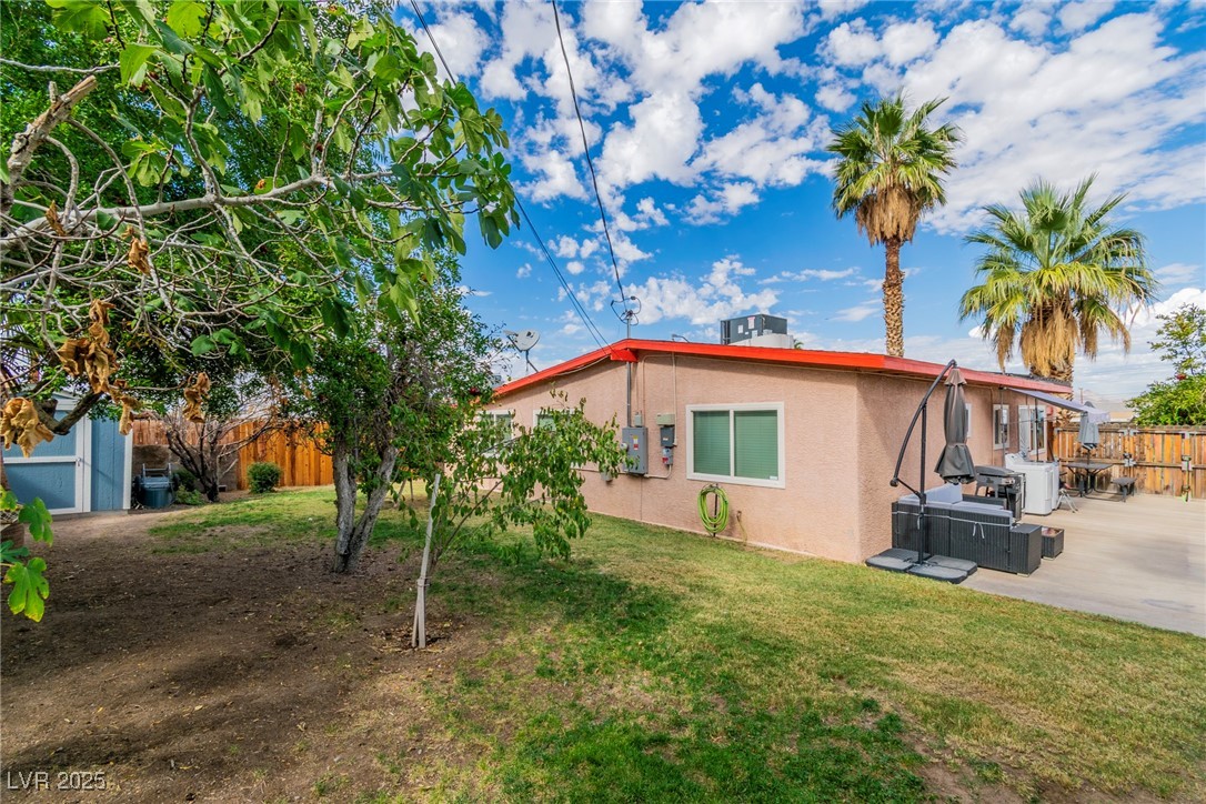 111 Maple Street Henderson, NV 89015 - Photo 27 of 37 View of home's exterior featuring stucco siding and a central AC unit