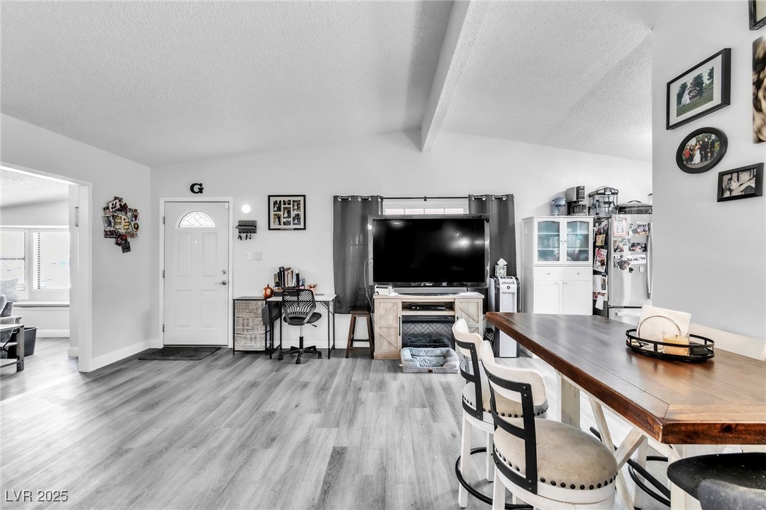 111 Maple Street Henderson, NV 89015 - Photo 4 of 37 Living area with a textured ceiling and light wood-type flooring