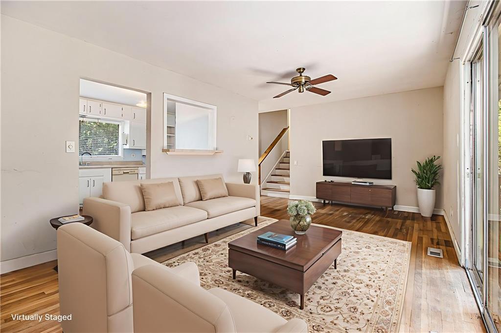 1961 Kenwood Road Southeast Smyrna, GA 30082 - Photo 16 of 33 a living room with furniture a rug and a window