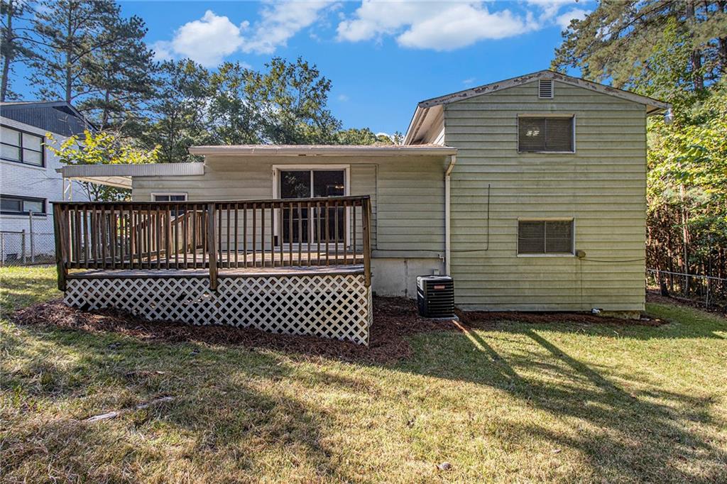 1961 Kenwood Road Southeast Smyrna, GA 30082 - Photo 30 of 33 a view of a house with a yard