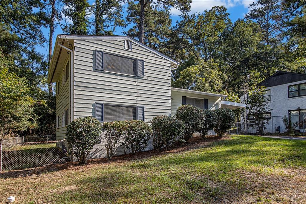 1961 Kenwood Road Southeast Smyrna, GA 30082 - Photo 3 of 33 a view of house with yard
