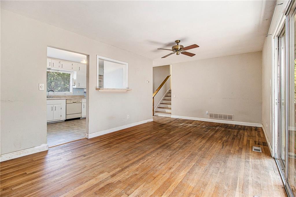 1961 Kenwood Road Southeast Smyrna, GA 30082 - Photo 8 of 33 wooden floor in an empty room with a window