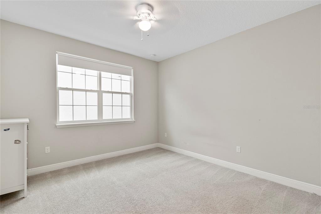 8764 Powder Ridge Trail Windermere, FL 34786 - Photo 30 of 43 an empty room with a window