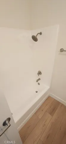 a view of a balcony with two chairs and a table