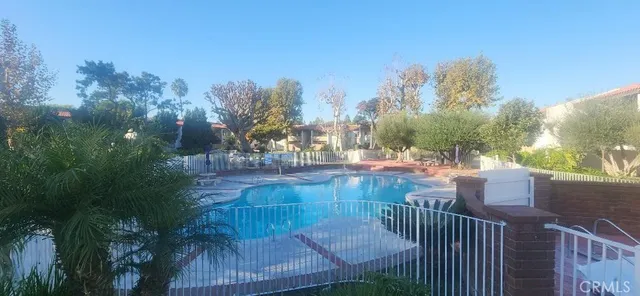 a view of a balcony with two chairs and a table