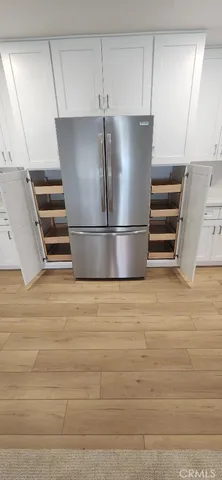 a kitchen with stainless steel appliances a refrigerator and a stove