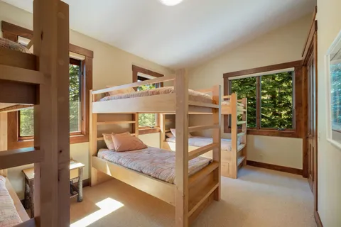 a bedroom with furniture and a window