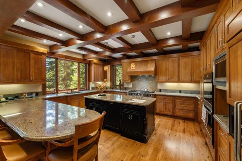 a kitchen with a stove a sink and a refrigerator